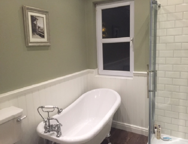 white-bathtub-tiled-surround-pink-led-strip